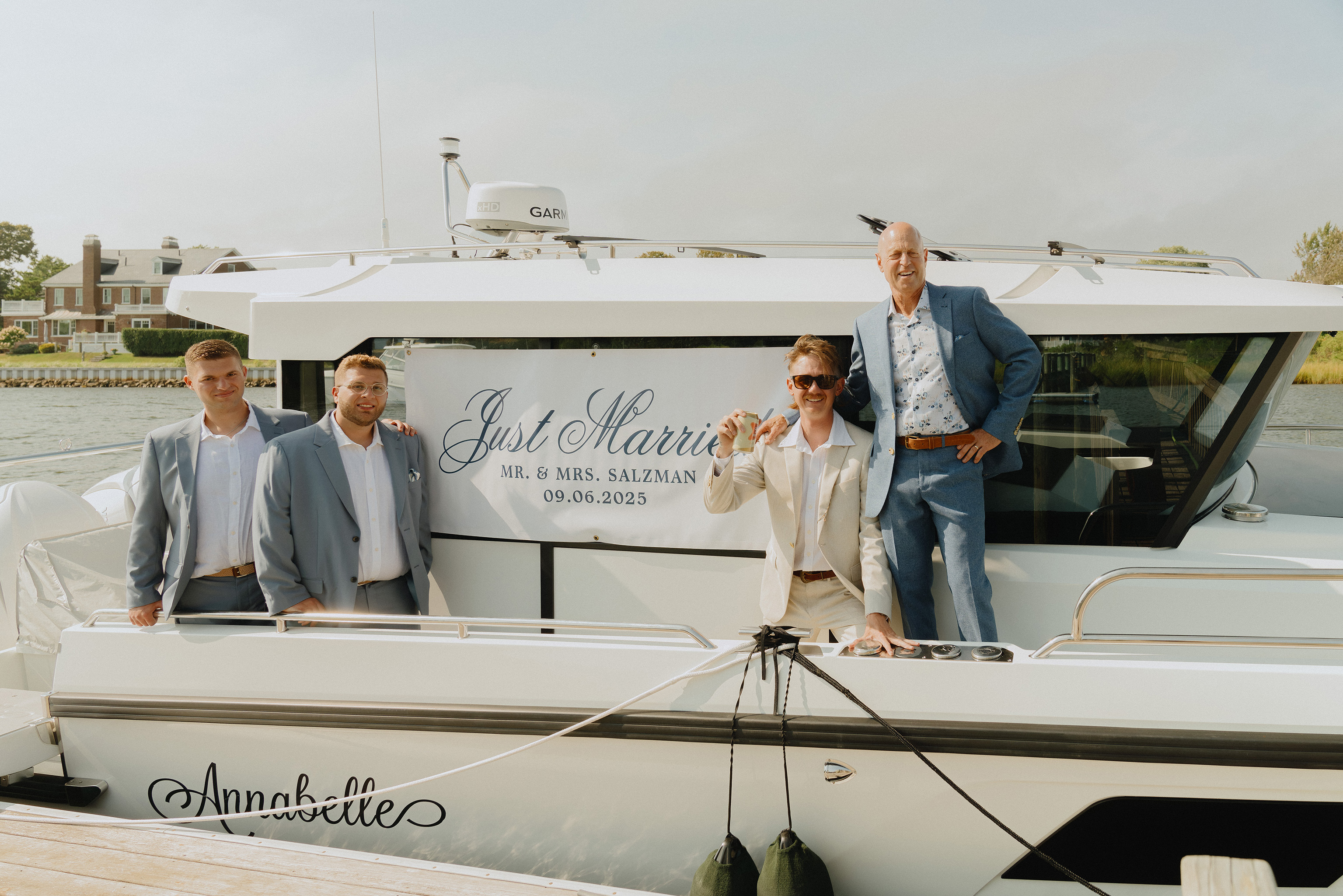 Adventurous wedding couple posing on a boat in Massachusetts coastal waters